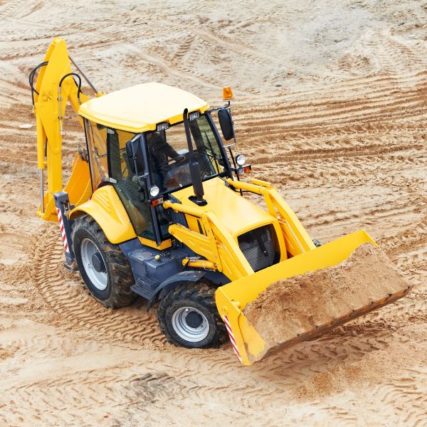 Backhoe loader working on a cleared rural block at Rural Property Services NSW, showing excavation, earthmoving, site preparation and grading work. Backhoe loader working on a cleared rural block at Rural Property Services NSW, showing excavation, earthmoving, site preparation and grading work.