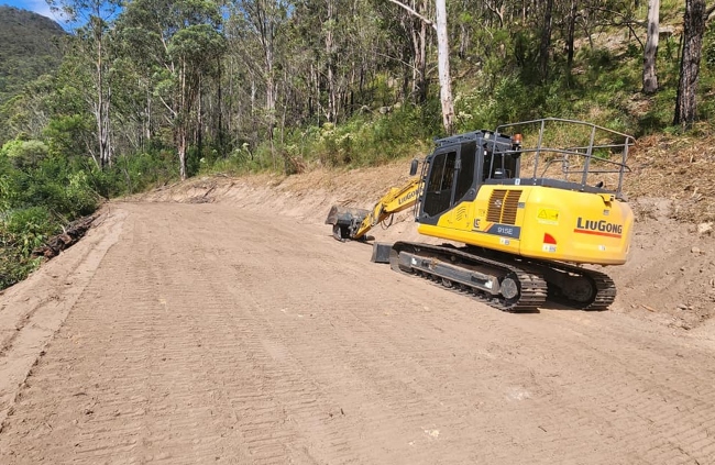 Bush track upgrade with excavator during private road construction by Rural Property Services NSW