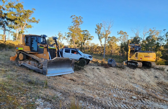 Earthmoving equipment on steep rural block during land prep by Rural Property Services NSW
