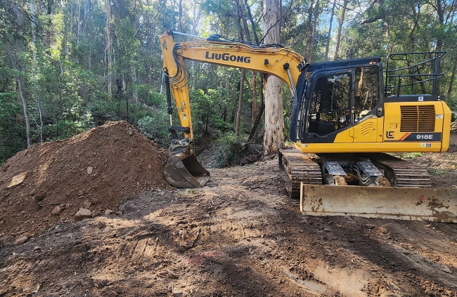 Excavation and earthmoving work in progress on forested site by Rural Property Services NSW