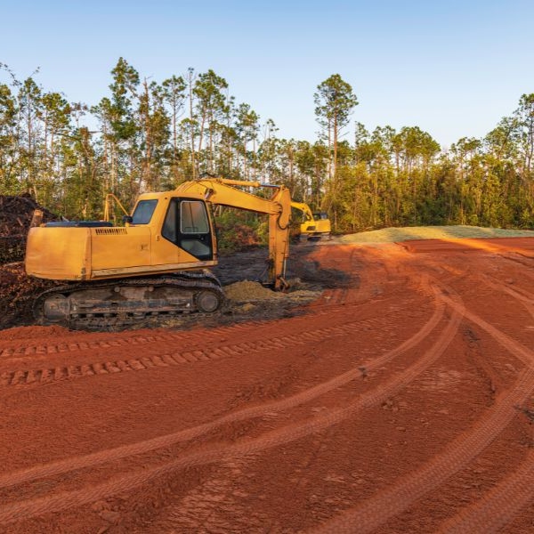 Heavy equipment parked on levelled land after full site preparation for construction by Rural Property Services NSW