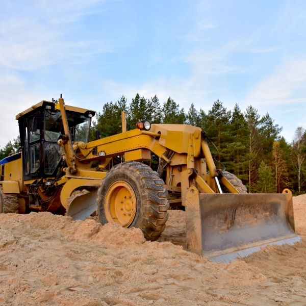 Site levelling and grading completed with heavy machinery on rural earthworks job by Rural Property Services NSW